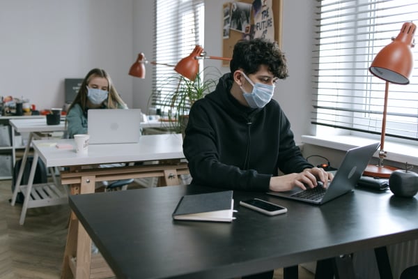 People with masks on doing test