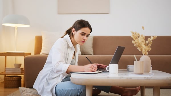 Woman studying and writing